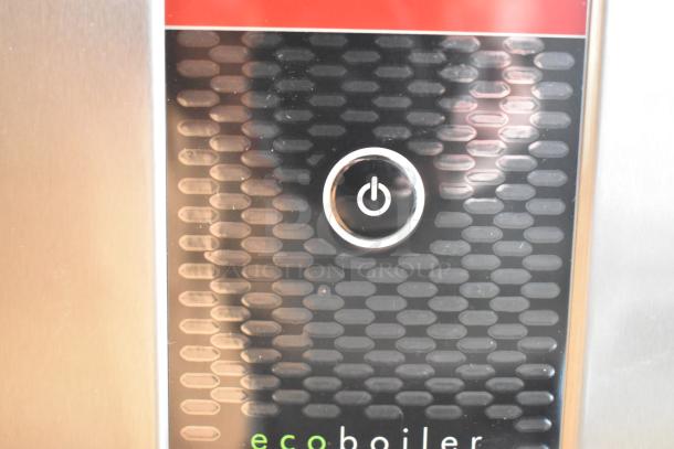 Brand new Grindmaster 1000665GM PB5US stainless steel ecoboiler hot water dispenser, 240V, 1 phase, minor scratches visible.