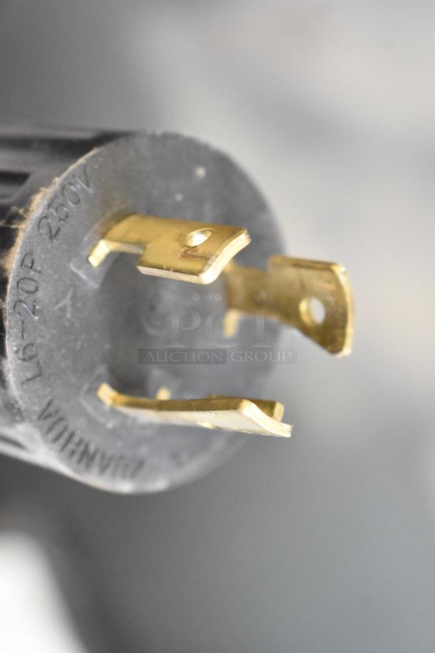 Close-up of a power plug for the Grindmaster 1000678GM PB10USG Ecoboiler Hot Water Dispenser, showing 240V, 1 Phase label.