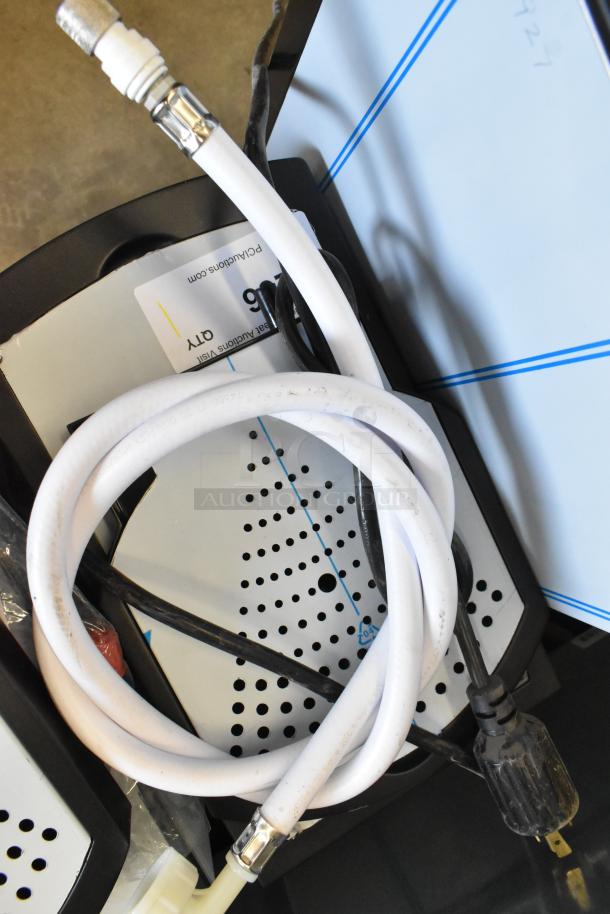 Brand new Grindmaster 1000665GM PB5US stainless steel Ecoboiler hot water dispenser, seen with power cable and hoses. 240 volts, 1 phase.