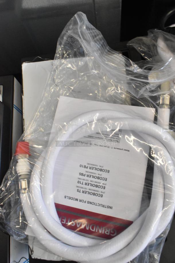 Brand new Grindmaster Ecoboiler PB5US, model 1000665GM, in original packaging. Includes instructions and hose. Stainless steel.