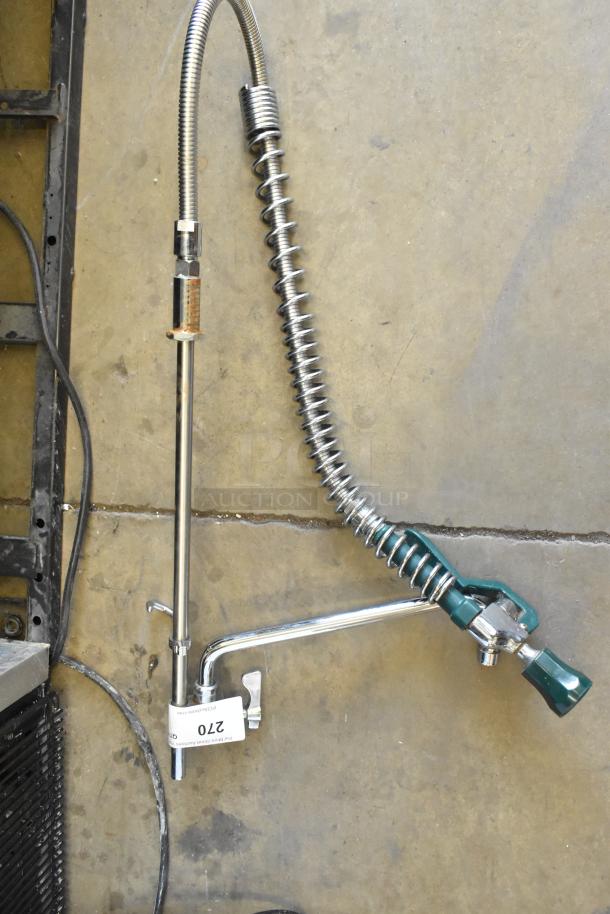 Metal faucet with spray nozzle, chrome finish, flexible hose, spring support. Auction tag: 270. Excellent condition.