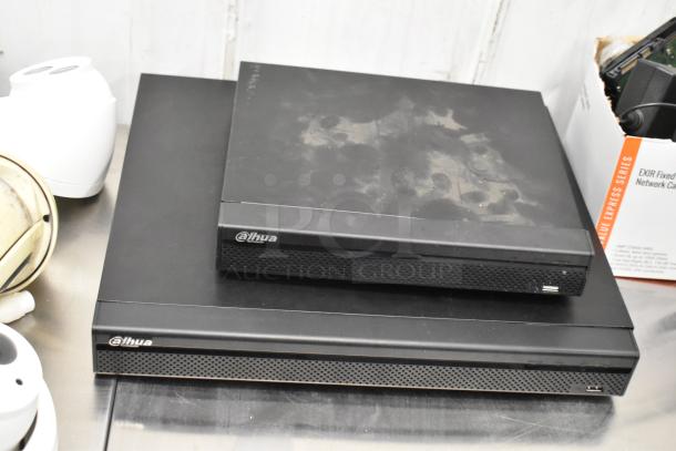 Security camera kit with 8 units, featuring 2 black Alhua recording devices. Good condition, ideal for surveillance.