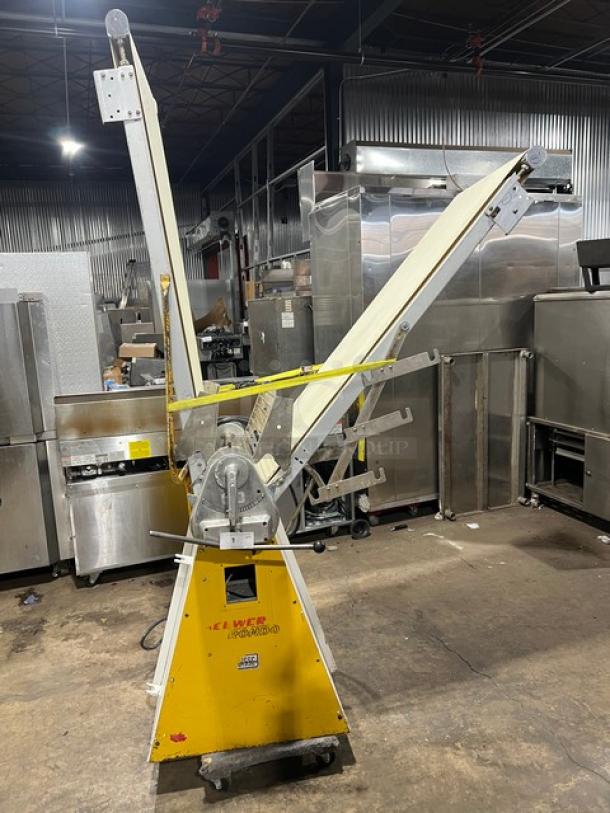 Seewer Rondo SS063 commercial dough sheeter, reversible conveyor, yellow casing, model SN: A-3088002, used condition.