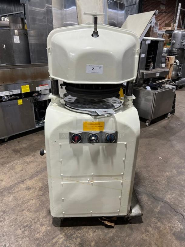 Gemini commercial white electric dough divider/rounder machine with rounding plate, front controls; industrial setting.