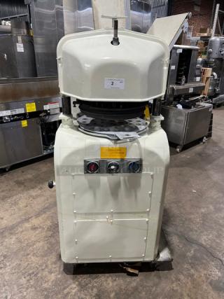 Gemini commercial white electric dough divider/rounder machine with rounding plate, front controls; industrial setting.