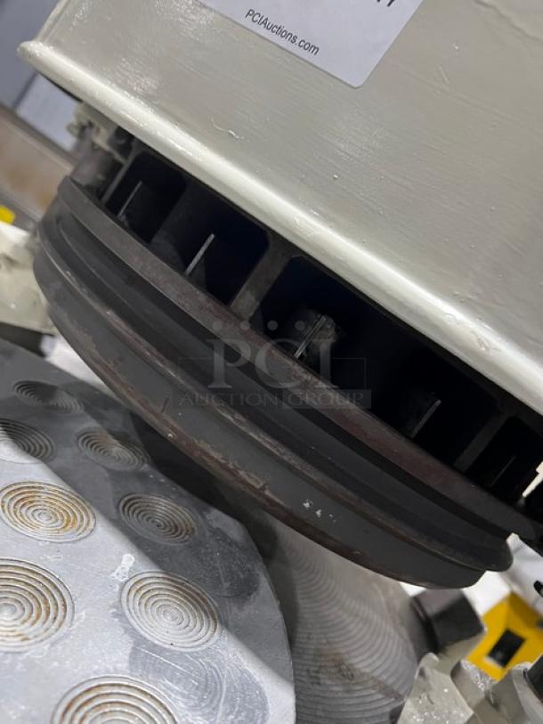 Gemini semi-automatic dough divider/rounder machine in white, featuring a rounding plate. Appears in used condition.