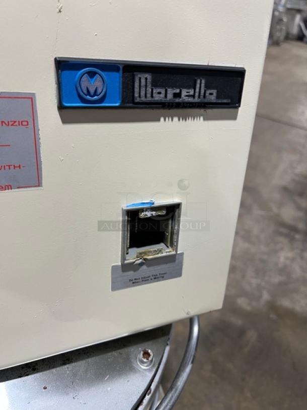 Morello white electric pizza dough spinner/stretcher/press machine with visible logo and label, on metal legs.