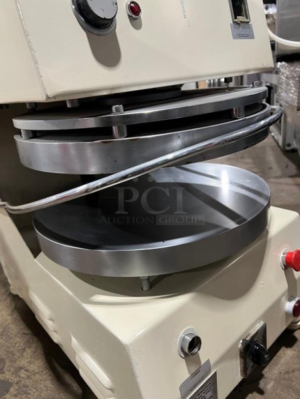 Morello commercial white electric pizza dough spinner/stretcher/press machine, mounted on legs. Features metal pressing plates and control knobs.