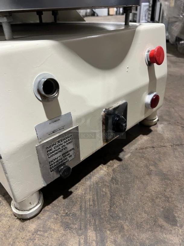 Morello commercial pizza dough spinner, white, electric-powered with cold system, on legs. Features visible control knobs.