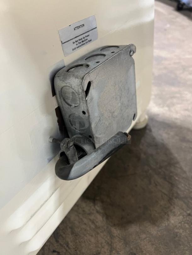 Morello commercial pizza dough machine, white, electric-powered. Cold system for dough spinning. On legs. Power box detail shown.