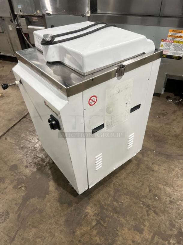 Bongard commercial white electric dough divider, floor model, hydraulic, serial number 0102584, used condition.