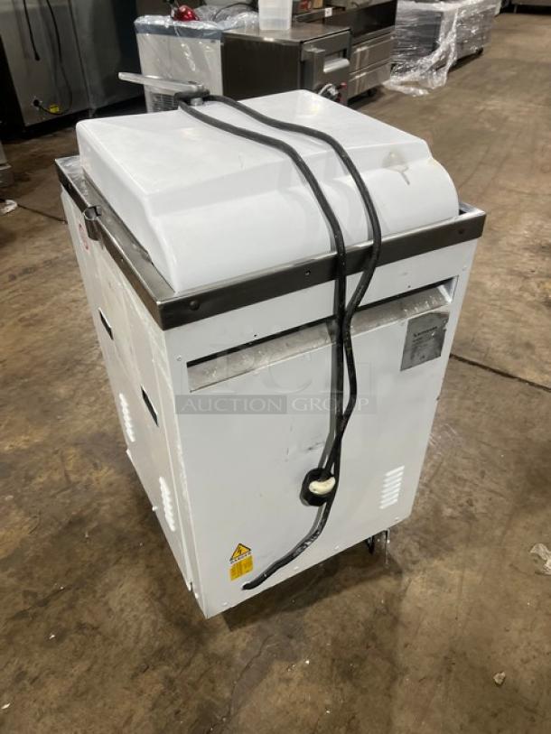 Bongard white electric hydraulic dough divider, floor model, SN: 0102584, used condition. Features sturdy design, power cord attached.