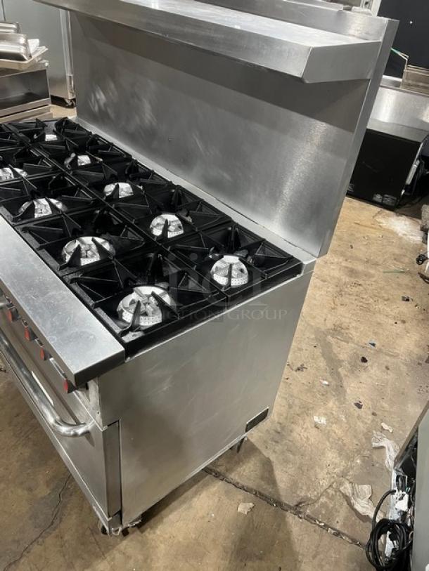 CPG Stainless Steel 60" 10 Burner Range/Double Oven, Model S60N. Features gas power, backsplash, salamander shelf, on casters.