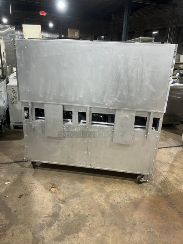 CPG S60N 60" stainless steel 10-burner range with double oven combo, backsplash, overhead salamander shelf, wired oven rack, on casters.