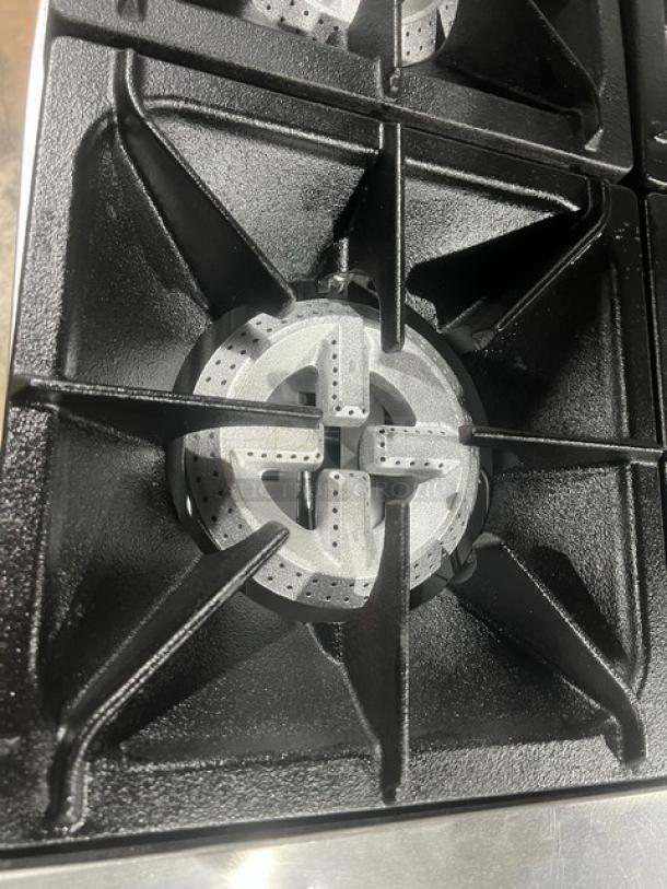 CPG S60N stainless steel gas range burner, part of a 60" 10-burner range/oven combo with overhead salamander shelf.