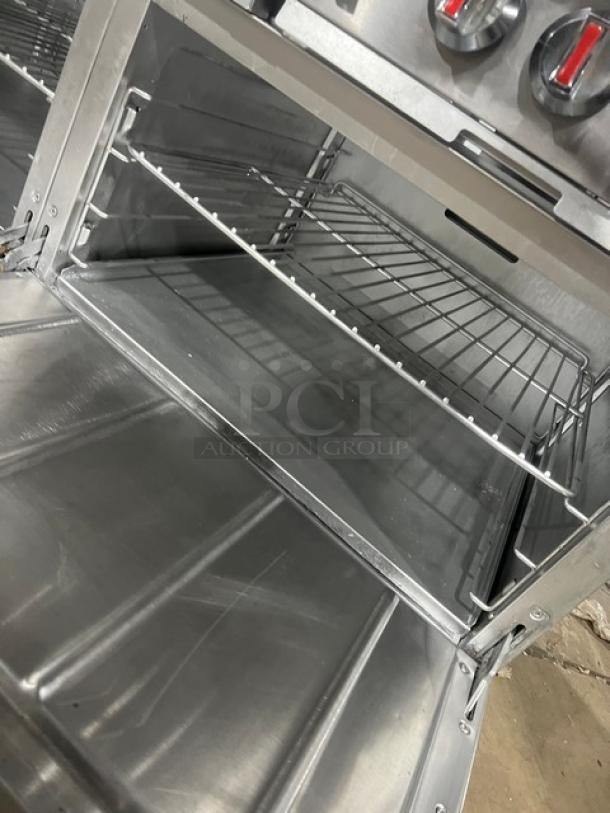 CPG S60N 10 burner range with double oven combo. Stainless steel, natural gas, with wired rack, backsplash, salamander shelf.