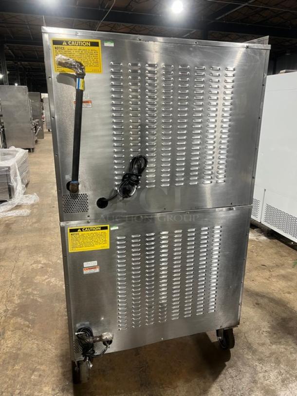 Vulcan SG4D-1 double-stacked stainless steel convection oven, natural gas, on casters, with wired rack.