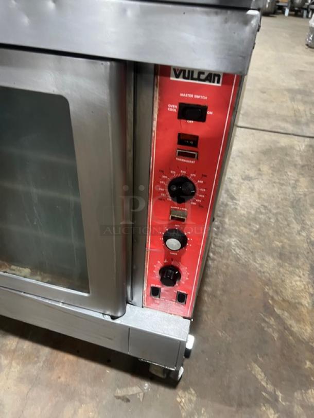 Vulcan SG4D-1 stainless steel double-stacked convection oven, natural gas, wired rack, on casters, visible control panel.