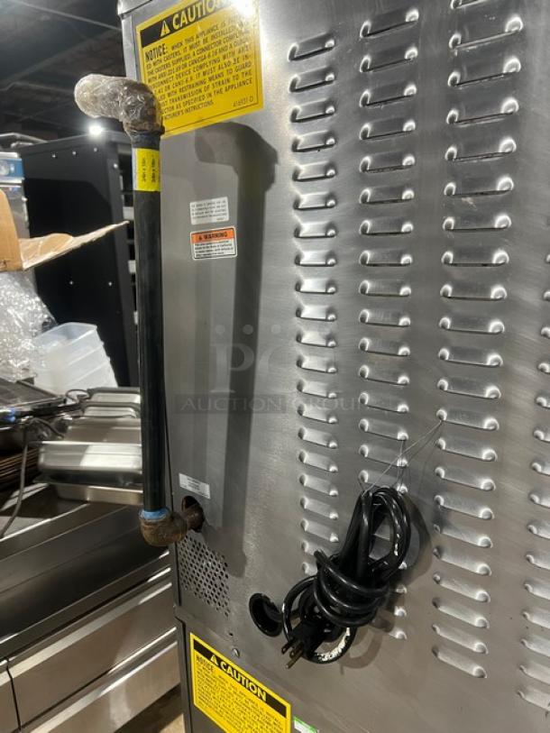 Vulcan SG4D1 commercial stainless steel convection oven, natural gas, double stacked, wired rack, on casters, safety labels.