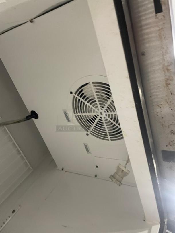 True T-23F commercial stainless steel single door reach-in freezer interior. Includes poly coated wire rack, Energy Star certified, on casters.