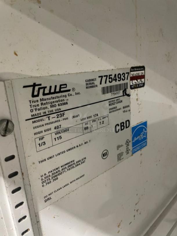 True T-23F stainless steel reach-in freezer, Energy Star, with poly-coated wire rack, model SN: 7754937, 115V, on casters.