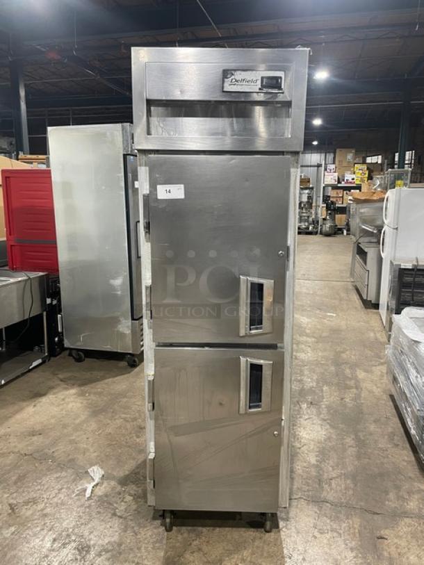Delfield Specification Line SMR1NSH13 stainless steel two-door reach-in refrigerator on casters, 115V, with wired oven rack.