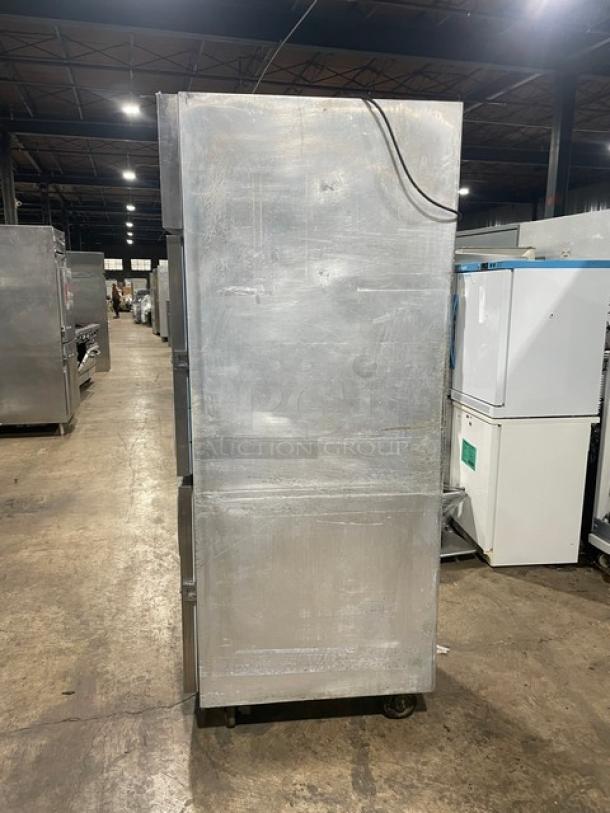 Delfield Specification Line Series stainless steel two-door reach-in refrigerator, model SMR1NSH13, with casters, wired oven rack.