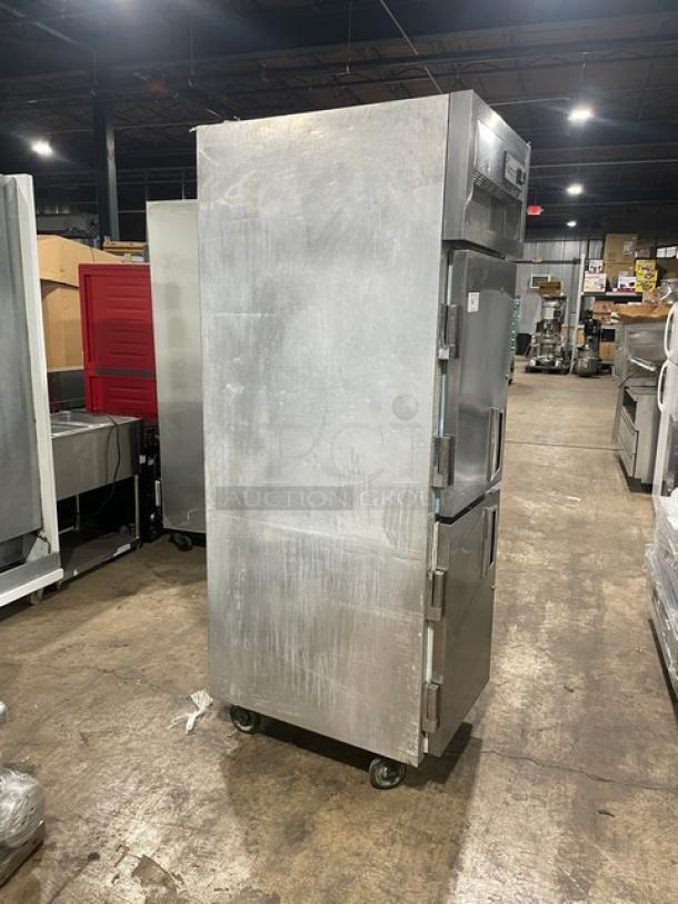 Delfield Specification Line stainless steel two-door reach-in refrigerator, model SMR1N-SH13, with caster wheels.