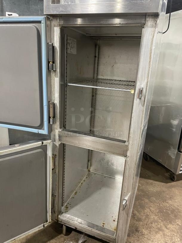 Delfield SMR1N-SH13 stainless steel two-door refrigerator with wired oven rack, on casters, commercial use, moderate wear.