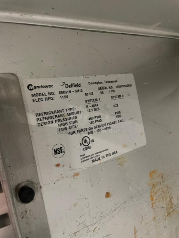 Delfield SMR1N-SH13 label showing model, serial number, electrical requirements, and refrigerant details. 115V, 1 Phase.