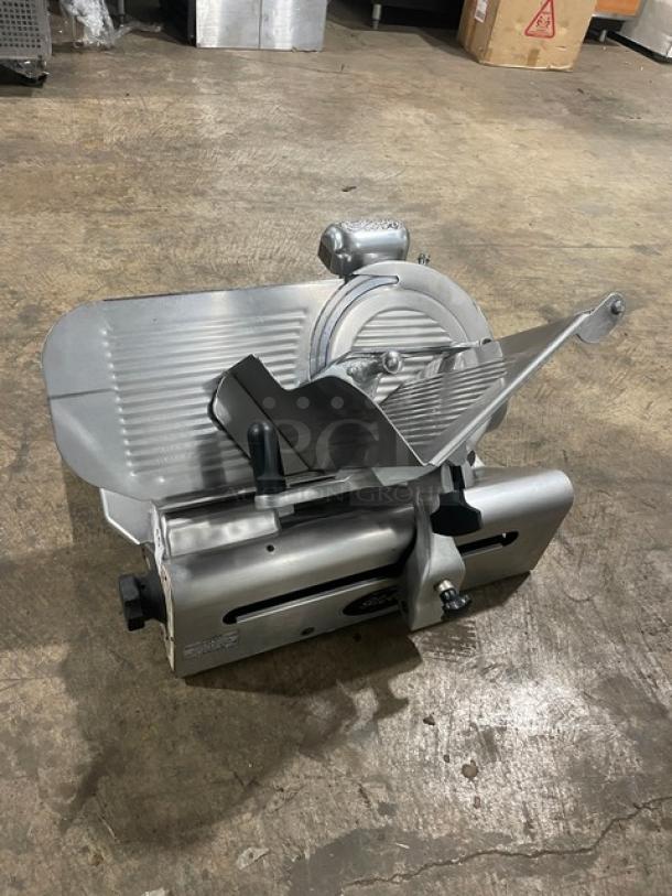 Globe 500L stainless steel electric deli slicer, countertop model; heavy-duty, on legs, used condition.