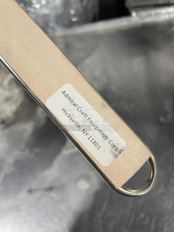 Adcraft stainless steel strainer with hardwood handle; features label: "Admiral Craft Equipment Corp, Hicksville, NY 11801."