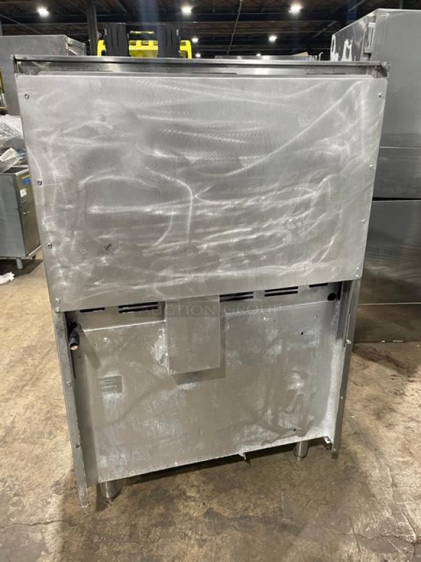 American Range commercial stainless steel natural gas 6-burner range/oven combo with backsplash, overhead shelf, and wired rack.