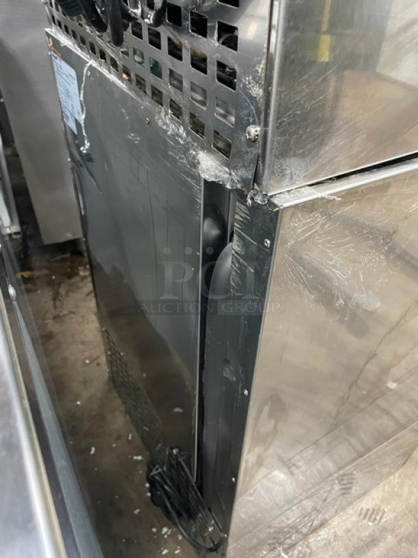 Follett REF5 stainless steel undercounter refrigerator, commercial-grade, with poly coated wired rack, visible wear on surface.