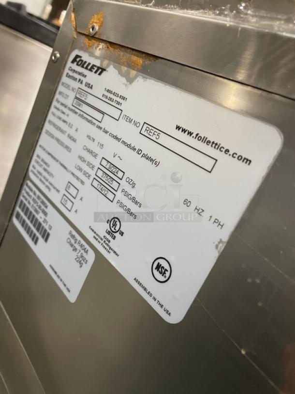 Follett REF5 medical-grade refrigerator, stainless steel, with poly-coated rack. Shows manufacturer label with specs and NSF logo.
