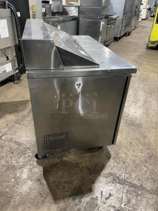 Turbo Air MST-48-N 2-door stainless steel refrigerated prep table, bain marie style, with poly-coated rack, on casters.