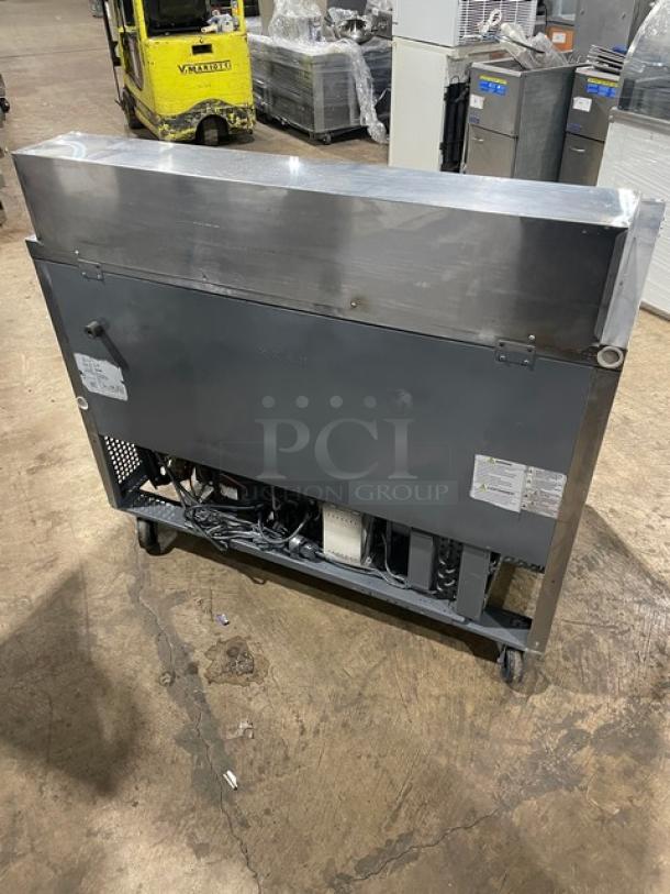 Turbo Air MST-48-N stainless steel 2-door refrigerated prep table on casters, showing back panel and wiring, includes labels.