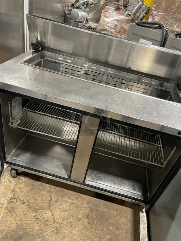 Turbo Air MST-48-N refrigerated prep table, stainless steel, 2 doors, poly-coated wired rack, on casters, 115V.