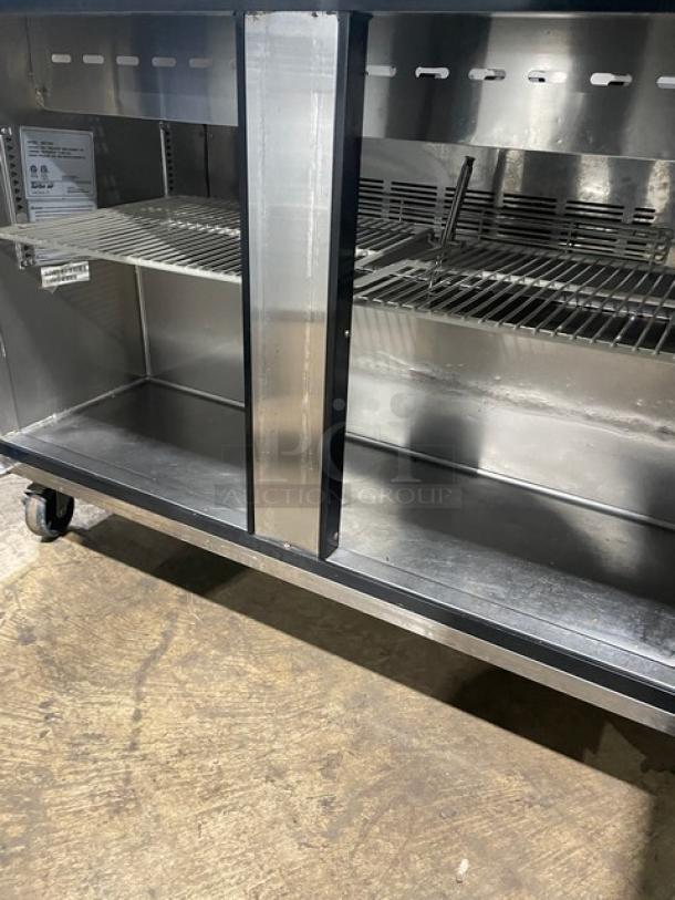 Turbo Air MST-48-N stainless steel 2-door refrigerated prep table, poly coated rack, 115V, on casters, excellent condition.