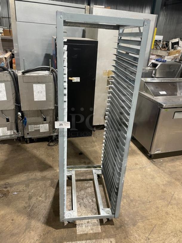 Commercial refrigerator/proofer rack on casters, metal, 20-slot capacity, good condition. Auction tag marked "25."