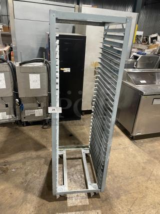Commercial refrigerator/proofer rack on casters, metal, 20-slot capacity, good condition. Auction tag marked "25."