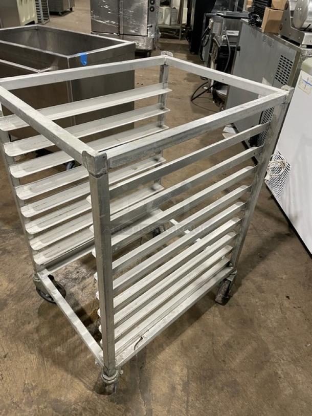 Commercial half-sized refrigerator/proofer rack on casters, metal frame, multi-shelf design, suitable for bakery or kitchen use.