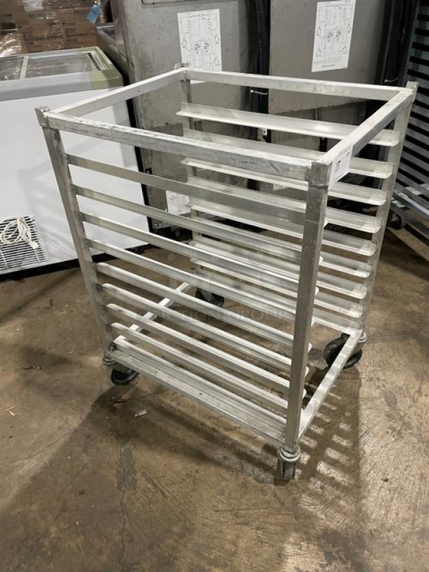 Commercial half-sized refrigerator/proofer rack on casters, metal construction, multiple shelves, used condition.