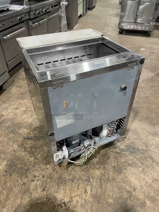 Turbo Air TST-28SD stainless steel refrigerated prep table, single door, with cutting board, 115V, on casters.