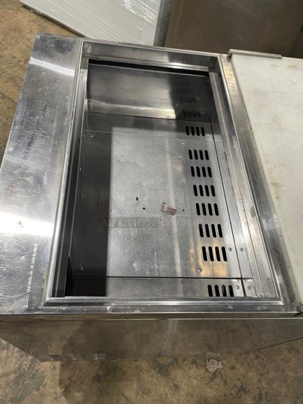 Turbo Air TST-28SD single door refrigerated salad prep table, stainless steel, with cutting board, on casters, 115V.