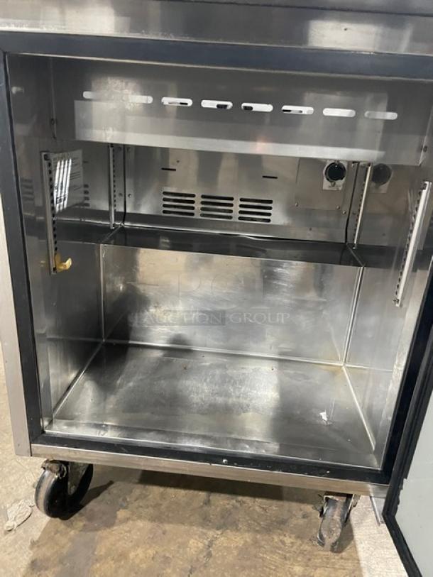 Turbo Air TST-28SD commercial stainless steel refrigerated prep table, single door, includes cutting board, on casters, 115V.