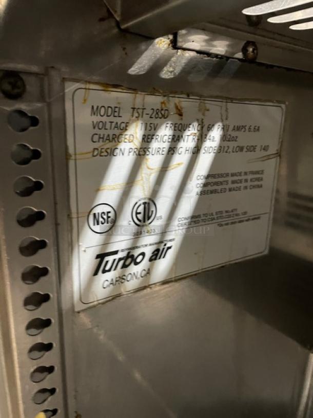 Turbo Air commercial salad/sandwich prep table, Model TST-28SD, stainless steel, includes cutting board, 115V, on casters.