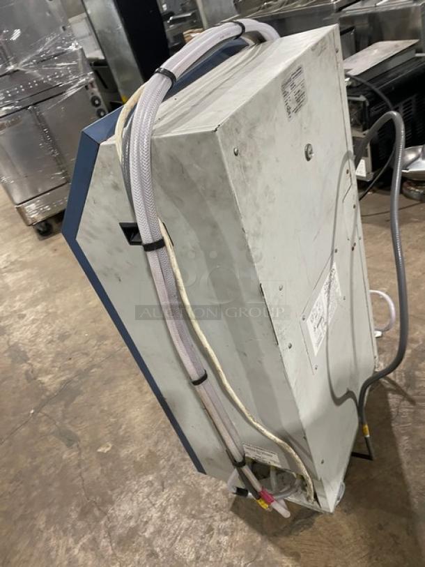 Oceanaire OWC1811 water-cooled portable air conditioner, 115V, on casters. Features hoses and visible unit labels.