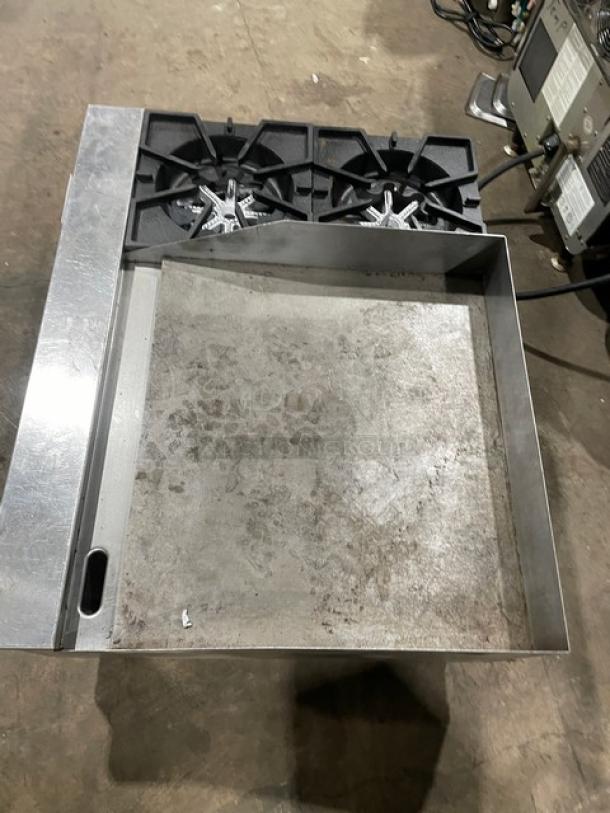 Comstock-Castle stainless steel 2-burner split top griddle range, model FHP36-24, with back and side splash, on legs.