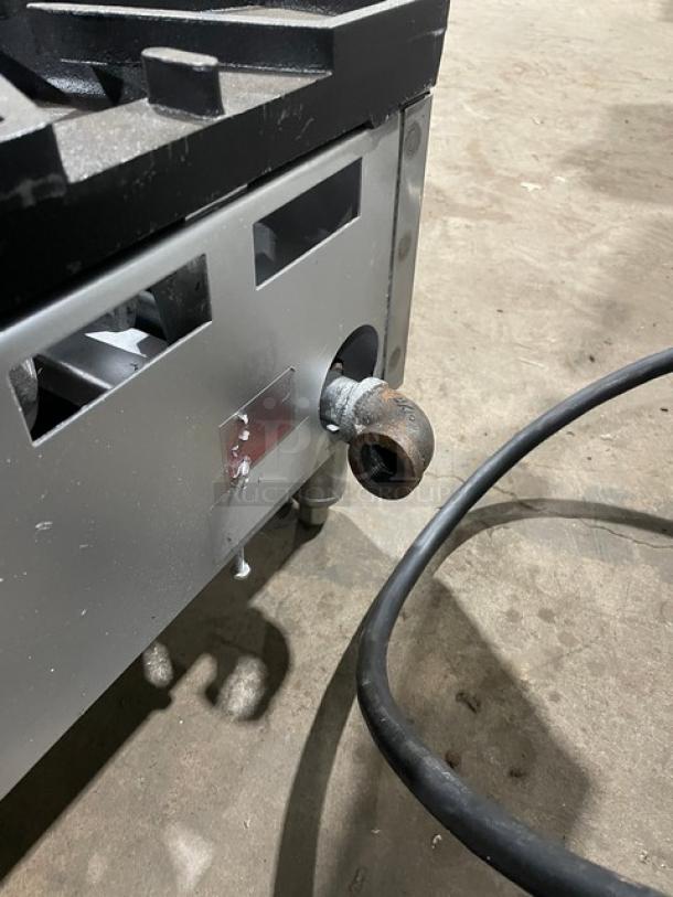 Comstock-Castle stainless steel gas griddle range, Model FHP3624, shown with side gas inlet and visible surface wear.